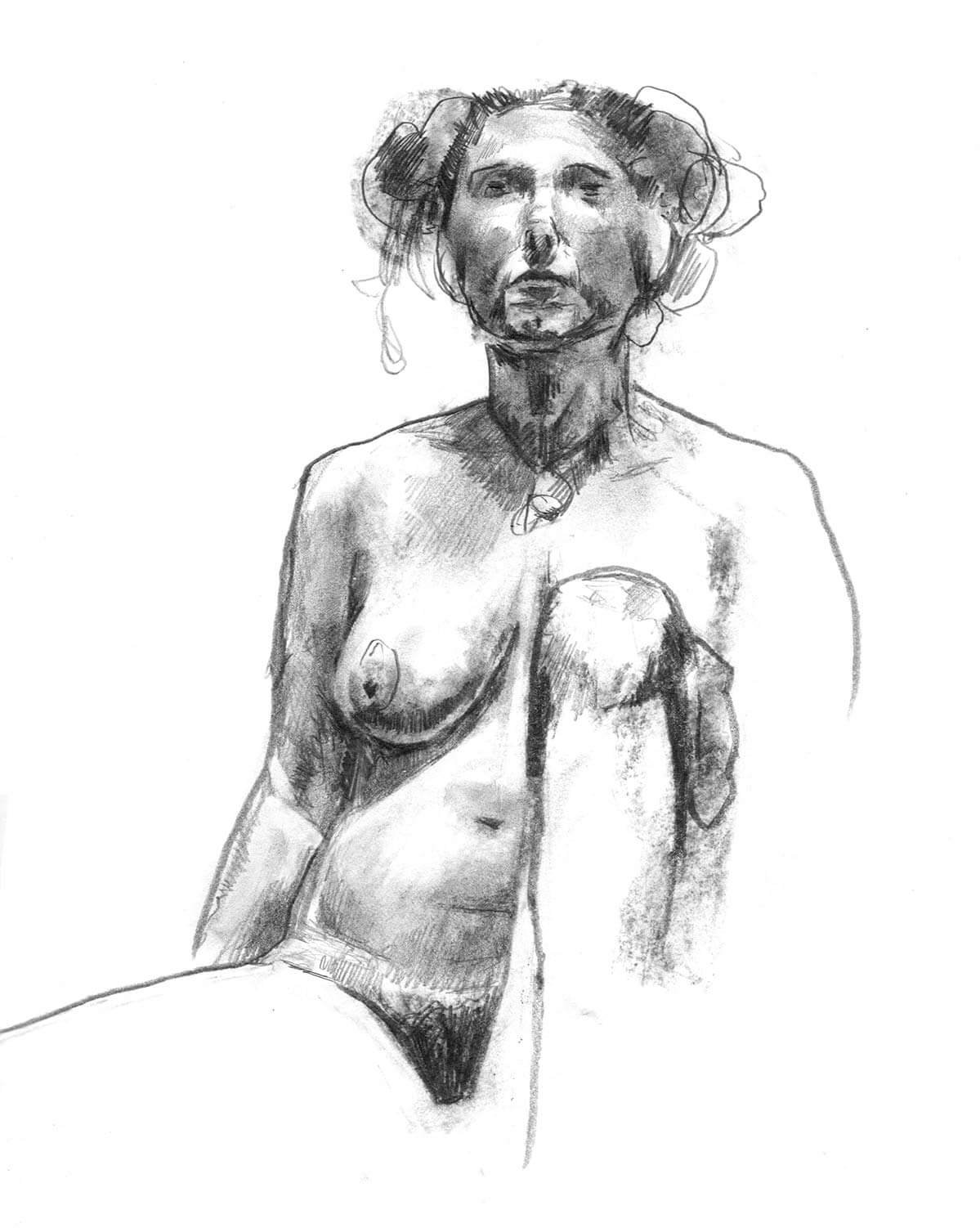 Female model seated with left knee to the chest