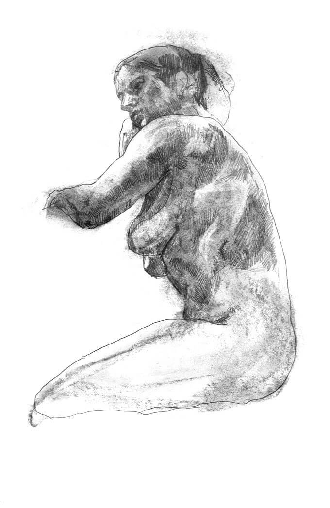 Female model kneeling with arms resting on a chair