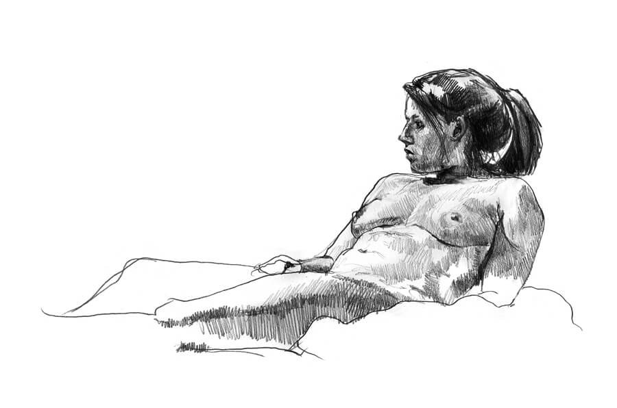 Female model laying back with arm bracing her torso looking to the left