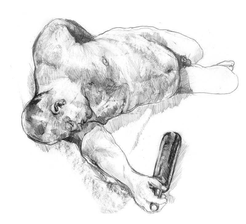 Male model laying on the floor in a mocking drunk position with a bottle in his right hand