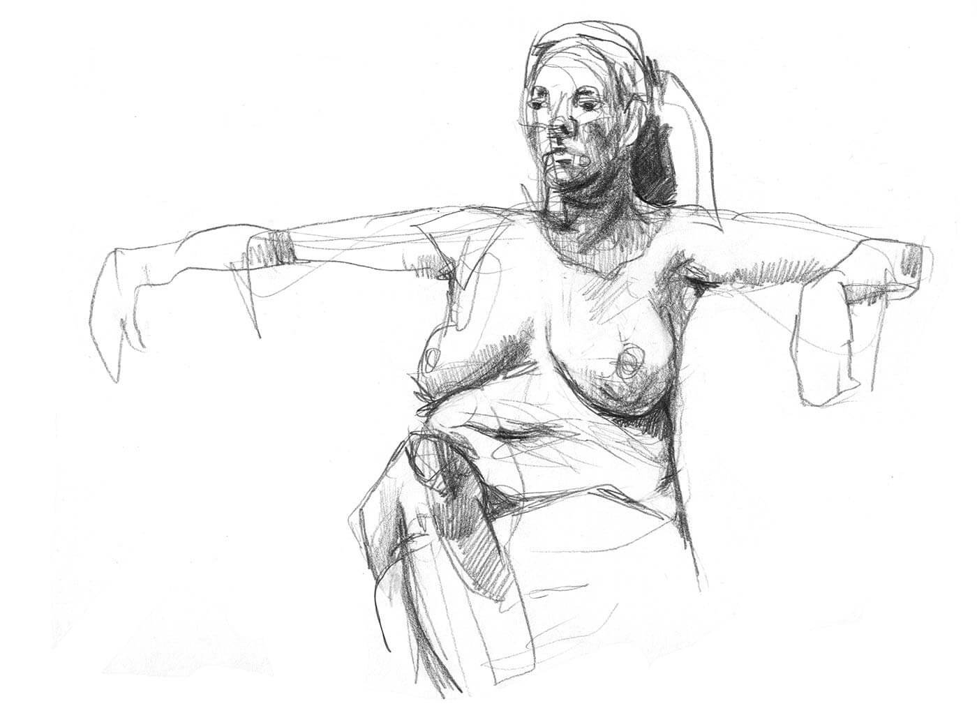 Seated female model with arms out stretched at shoulder height